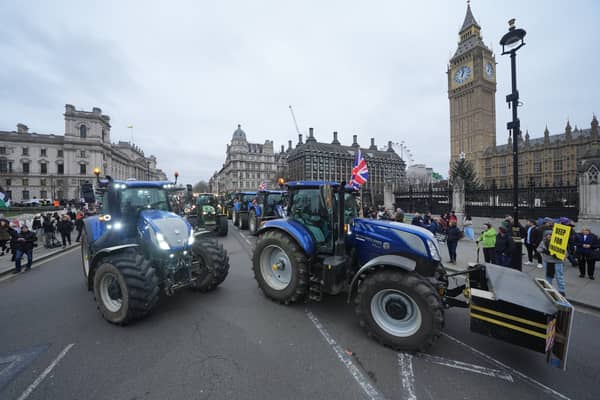 Tractors are lined up outside the Houses of Parliament in Westminster, London, during a protest by farmers over the changes to inheritance tax