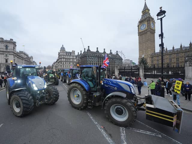 Tractors are lined up outside the Houses of Parliament in Westminster, London, during a protest by farmers over the changes to inheritance tax
