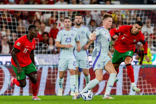 Scotland will be on the road - potentially against Portugal - in their first World Cup qualifier.