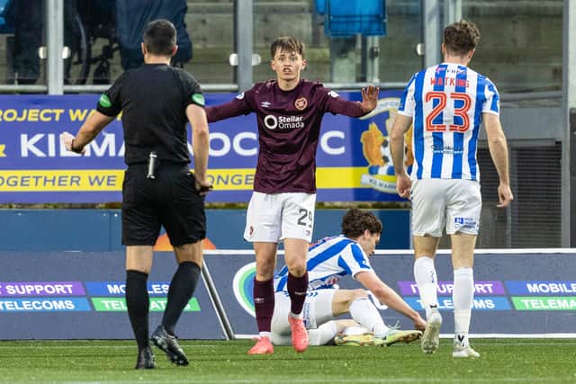 Hearts' James Penrice remonstrates with refere Don Robertson after fouling Kilmarnock's Joe Wright and giving away a penalty.