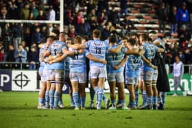 The Glasgow Warriors players huddle after the defeat in Toulon.