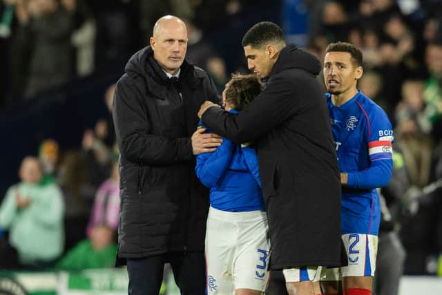 Rangers left-back Ridvan Yilmaz is consoled by his teammates after missing the crucial penalty in the shootout defeat to Celtic. Cr: SNS Group.