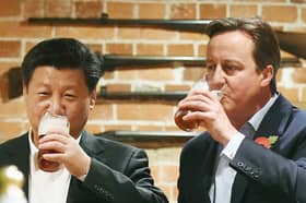 David Cameron and Xi Jinping have a pint in a pub near Chequers in 2015 (Picture: Andy Rain/pool)