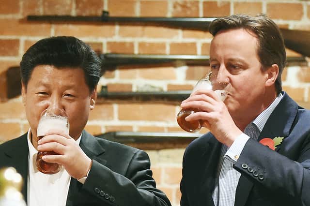 David Cameron and Xi Jinping have a pint in a pub near Chequers in 2015 (Picture: Andy Rain/pool)