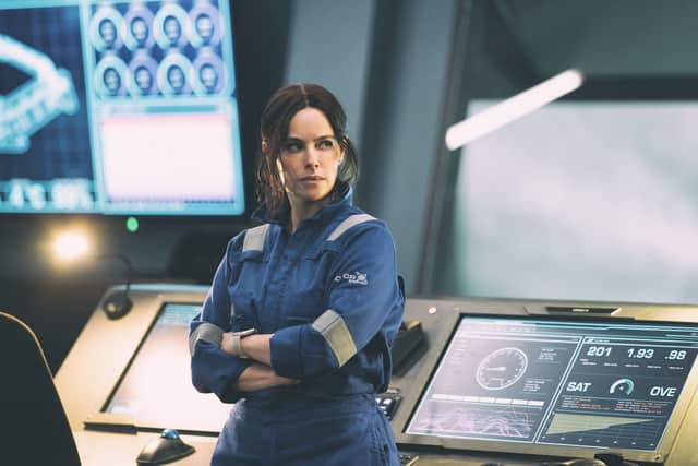 Emily Hampshire as scientist Rose Mason