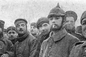British soldiers with with German Saxon regimental troops at Ploegsteert Wood in Belgium during the Christmas Truce of World War One, December 1914. Private John Saunders, of Perth, who served with the 1st Royal Warwickshire Regiment, is believed to have been stationed here at the time he “fraternised with Germans” that Christmas.(Photo by Popperfoto via Getty Images/Getty Images)  