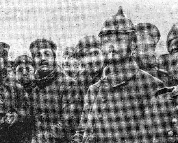 British soldiers with with German Saxon regimental troops at Ploegsteert Wood in Belgium during the Christmas Truce of World War One, December 1914. Private John Saunders, of Perth, who served with the 1st Royal Warwickshire Regiment, is believed to have been stationed here at the time he “fraternised with Germans” that Christmas.(Photo by Popperfoto via Getty Images/Getty Images)  