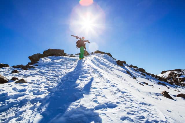 A skier standing at the top of a slope in Sierra Nevada in Granada, Spain.