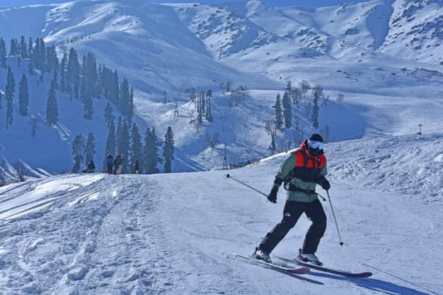 A skier skiing on the slopes of Gulmarg, India.