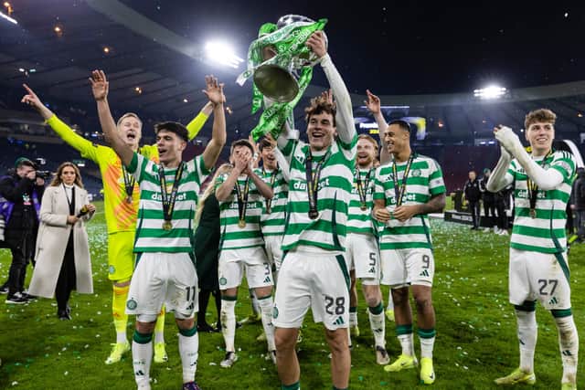 Celtic's Paulo Bernardo with the Premier Sports Cup trophy after the victory over Rangers at Hampden. (Photo by Craig Williamson / SNS Group)