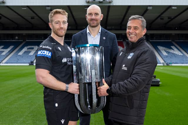 Glasgow Warriors captain Kyle Steyn, head coach Franco Smith and managing director Al Kellock with the URC trophy at Hampden.