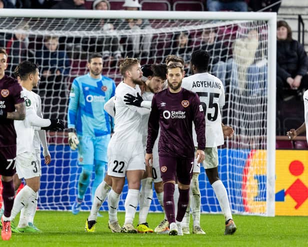 Hearts players are left dejected after Petrocub score to make it 2-2 at Tynecastle. (Photo by Ross Parker / SNS Group)