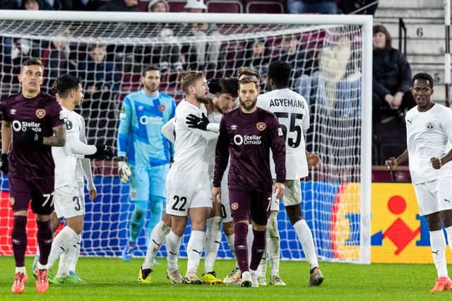 Hearts players are left dejected after Petrocub score to make it 2-2 at Tynecastle. (Photo by Ross Parker / SNS Group)