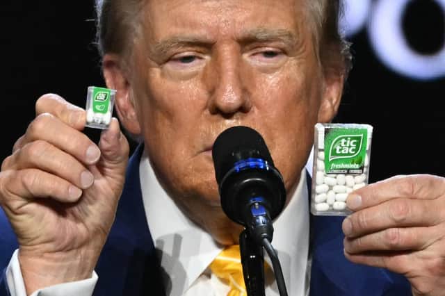 Donald Trump uses different-sized boxes of Tic-Tacs as props during a speech about inflation in Phoenix, Arizona, ahead of the US election (Picture: Jim Watson)