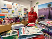 Prison officer Colin O’Flaherty surrounded by donated presents at HMP Edinburgh