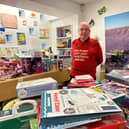 Prison officer Colin O’Flaherty surrounded by donated presents at HMP Edinburgh