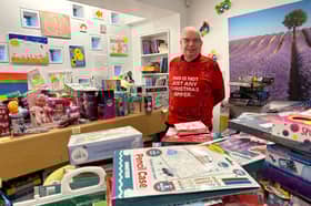 Prison officer Colin O’Flaherty surrounded by donated presents at HMP Edinburgh