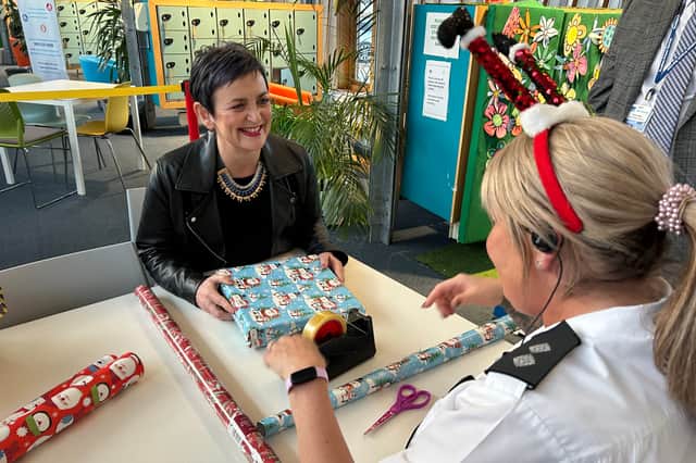 Justice Secretary Angela Constance helps to wrap gifts