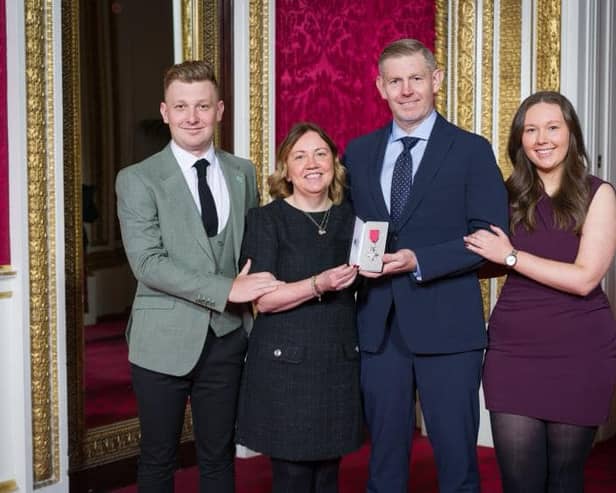 Stephen Gallacher shows off his MBE flanked by wife Helem son Jack and daughter Ellie at Buckingham Palace