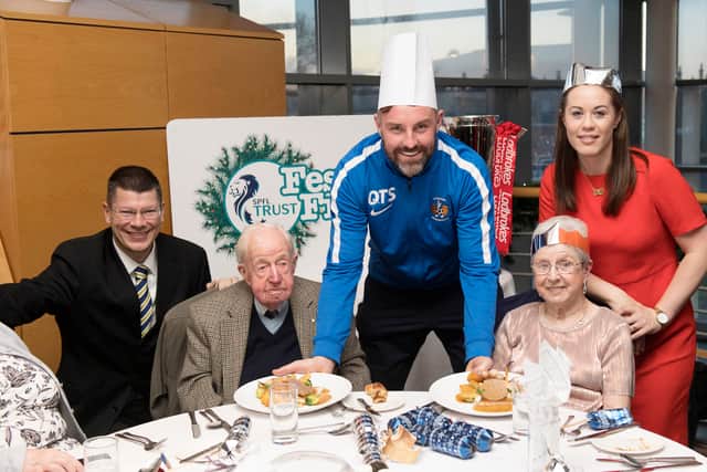 Nicky Reid joins Kris Boyd and SPFL chief executive Neil Doncaster to promote the Festive Friends programme which supporters socially isolated people at Christmas time through Kilmarnock FC in 2017.