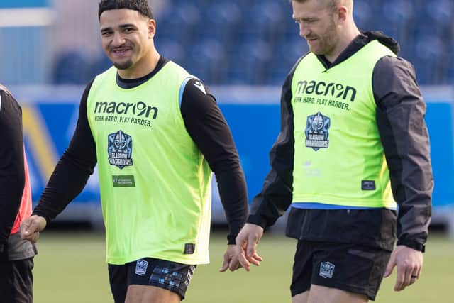 Sione Tuipulotu with Glasgow Warriors captain Kyle Steyn.