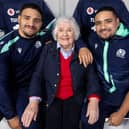 Brothers Sione, left, and Mosese Tuipulotu, right, with their grandmother Jaqueline Thomson. The pair will be up against each other when Glasgow play Edinburgh.