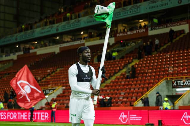 Elie Youan flies the Hibs flag high at Pittodrie.