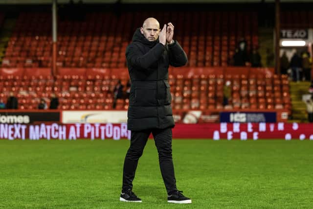 Hibs head coach David Gray applauds the Hibs fans at full time.