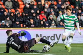 Celtic's Kyogo Furuhashi is closed down by Dundee United's Jack Walton. (Photo by Craig Foy / SNS Group)