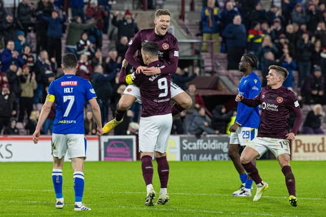 Blair Spittal's rasping effort gave Hearts a 2-1 win over St Johnstone.