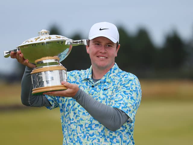 Bob MacIntyre shows off the Genesis Scottish Open trophy after his dramatic win at The Renaissance Club