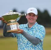 Bob MacIntyre shows off the Genesis Scottish Open trophy after his dramatic win at The Renaissance Club