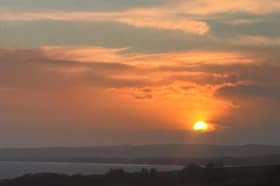 Sun sets over Montrose, Angus, on the shortest day. The mild conditions are set to continue over Christmas with 14 degrees Celsius due in parts of the North East on Tuesday. 