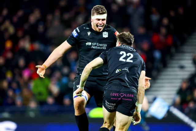 Glasgow's Jamie Dobie (No 22) celebrates a second half try with Scott Cummings against Edinburgh.