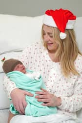 Anne-Marie Hunt, from Livingston, with her baby daughter who was born at 5.16am on Christmas Day morning at St John's Hospital, Livingston, weighing 6lbs 7oz. Dad Gordon Wilson is also doing well. PIC: Jane Barlow/PA Wire