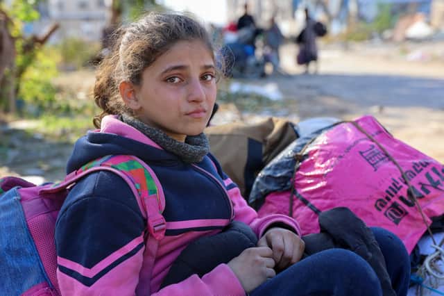 A Palestinian girl, displaced from Beit Lahia, rests as she arrives with her relatives in Jabalia in the northern Gaza Strip (Picture: Omar al-Qattaa)
