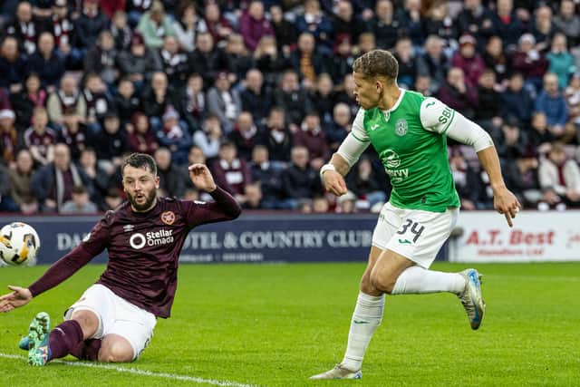 Hibs retake the derby lead with this sweet finish from Dwight Gayle.