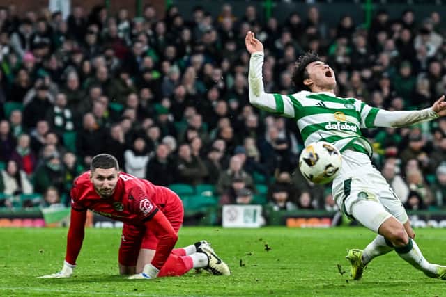 Celtic's Hyun-jun Yang is brought down in the box by Motherwell goalkeeper Aston Oxborough. (Photo by Rob Casey / SNS Group)