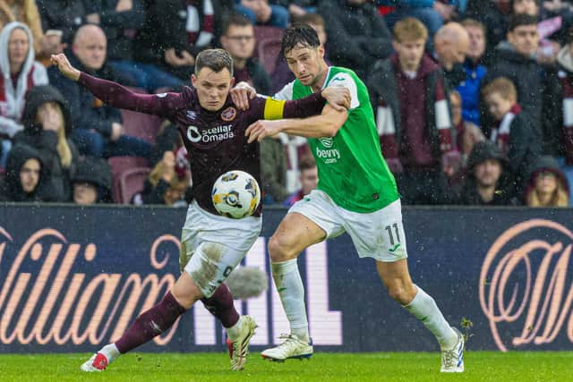Lawrence Shankland tangles with Joe Newell.