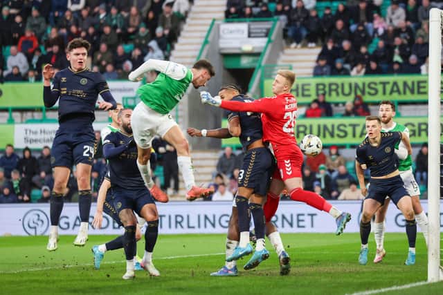 Nectar Triantis heads Hibs into the lead against Kilmarnock.