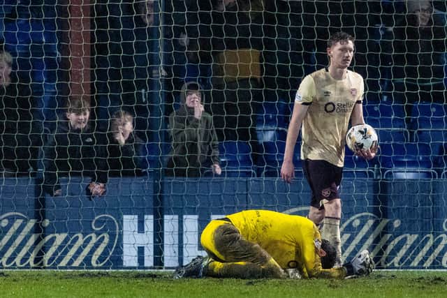 Hearts were left floored by two stoppage-time goals from Ross County.