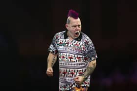 Peter Wright celebrates after beating Luke Humphries.