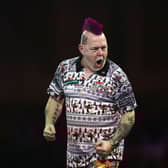 Peter Wright celebrates after beating Luke Humphries.