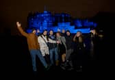 Friends from Germany who flew to Scotland for Hogmanay gathered outside Edinburgh Castle after the city's main Hogmanay events were cancelled.