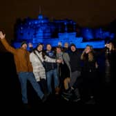 Friends from Germany who flew to Scotland for Hogmanay gathered outside Edinburgh Castle after the city's main Hogmanay events were cancelled.