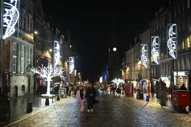 A near deserted Royal Mile in Edinburgh on Hogmanay after all outdoor events including the street party and fireworks display planned were cancelled due to bad weather. Picture: Andy Buchanan/PA Wire 