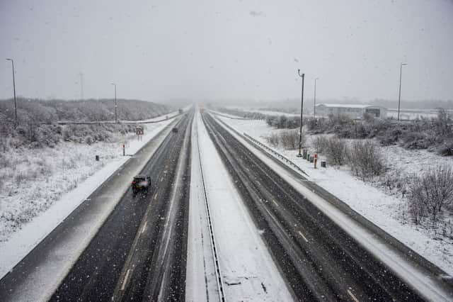 Snow falling on the M8 near Whitburn in West Lothian on New Year's Day