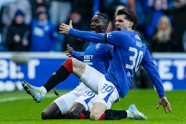 Ianis Hagi and Mohamed Diomande celebrate Rangers' opener.