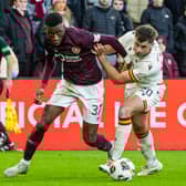 Hearts goalscorer Musa Drammeh tussles with Motherwell's Shane Blaney during the William Hill Premiership match at Tynecastle Park.  (Photo by Mark Scates / SNS Group)