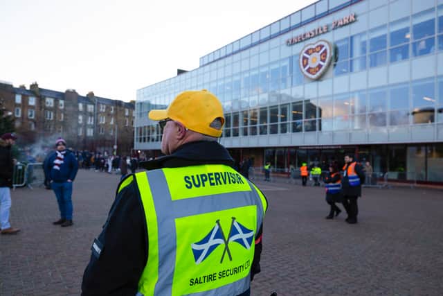 Hearts fans gathered in small numbers to protest outside the stadium ahead of the William Hill Premiership match against Motherwell. (Photo by Mark Scates / SNS Group)